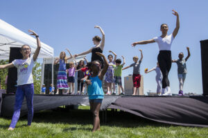 Visitors participate in a Kansas City Ballet workshop on the Community Partner Stage at Future Stages Festival 2017