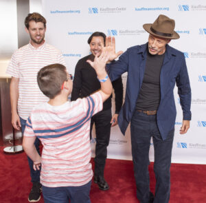 Youth Greets John Gries with a High Five